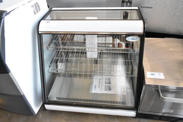 Brand new KoolMore CDC-4C-BK 27" countertop refrigerator display case, with minor scratches and dents, visible User Manual.