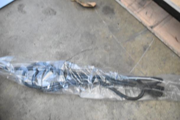 Plastic-wrapped cord for KoolMore CDC-4C-BK countertop refrigerator display case, suggesting intact but possibly unassembled condition.