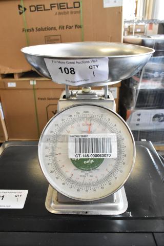 Yamato SM(N) metal countertop food portioning scale with weighing tray, visible control markings, and auction labels.