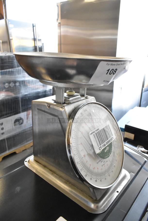 Yamato SM(N) metal countertop food portioning scale in good condition, showing scale face and stainless steel tray.