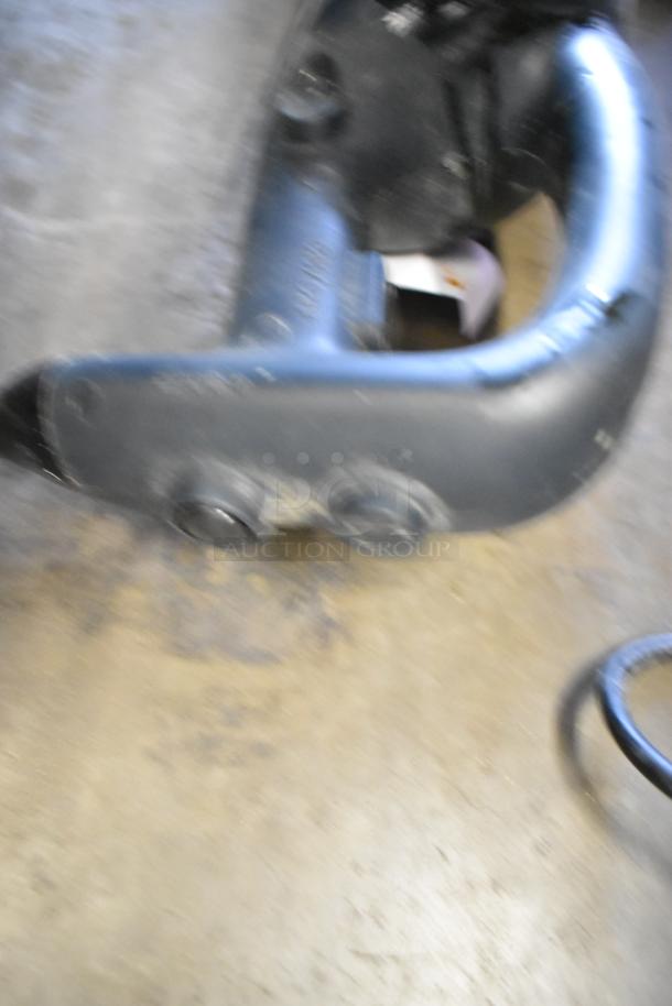 Blurred image of AvaMix 928IB18 commercial immersion blender. Features include 120 volts, 1 phase power.