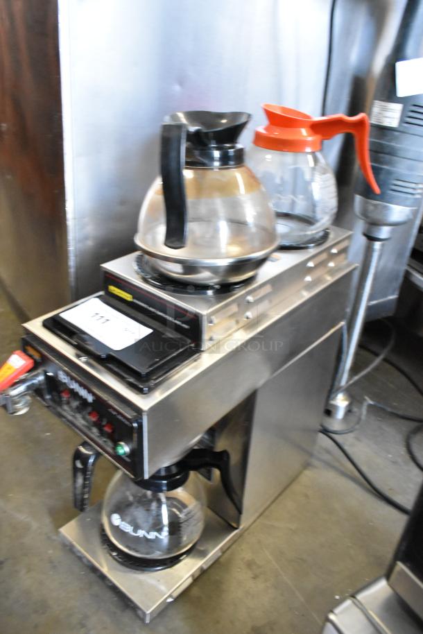 Bunn CWTF15 stainless steel commercial coffee machine with 3 burners, hot water dispenser, metal brew basket, and 3 pots.