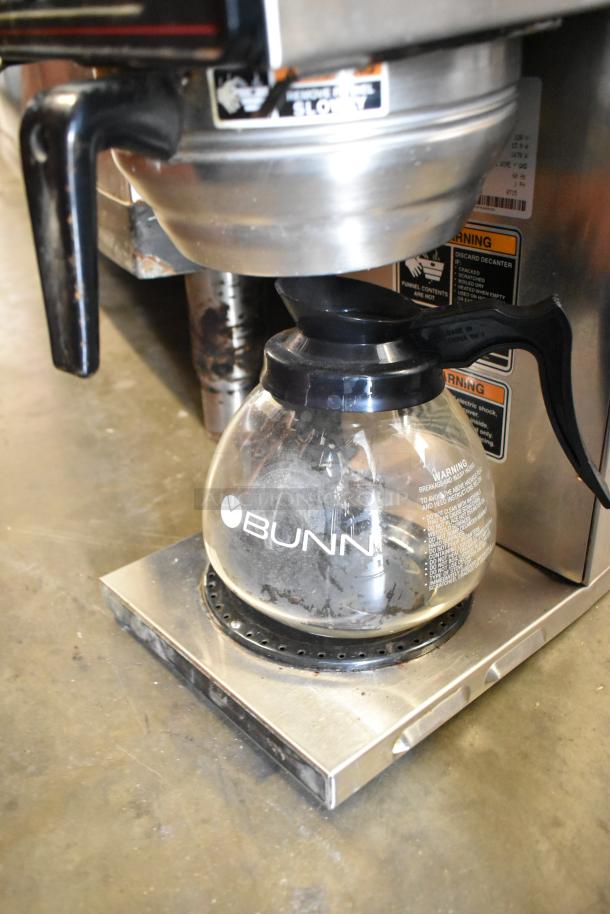 Bunn CWTF15 stainless steel coffee machine with 3 burners, hot water dispenser, metal brew basket, and pot. 120V, 1 phase.