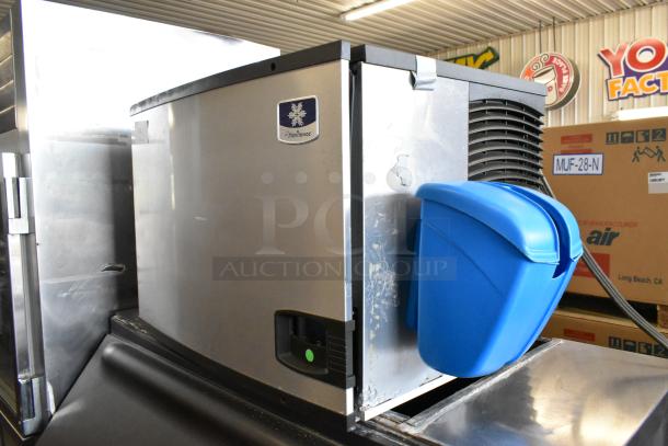 Manitowoc IY0606A-261 stainless steel commercial ice head on bin, 208-230V 1-phase. Some wear visible.