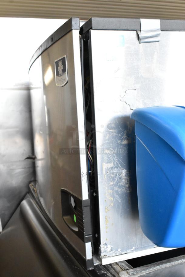 Manitowoc IY0606A-261 stainless steel commercial ice head on bin, showing some wear, 208-230V, 1 phase, visible label.