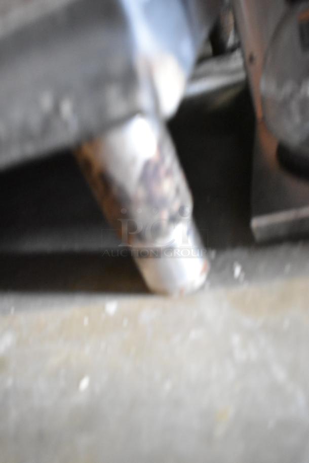 Manitowoc IY0606A-261 stainless steel commercial ice head, visible component detail, 208-230 volts, 1 phase.