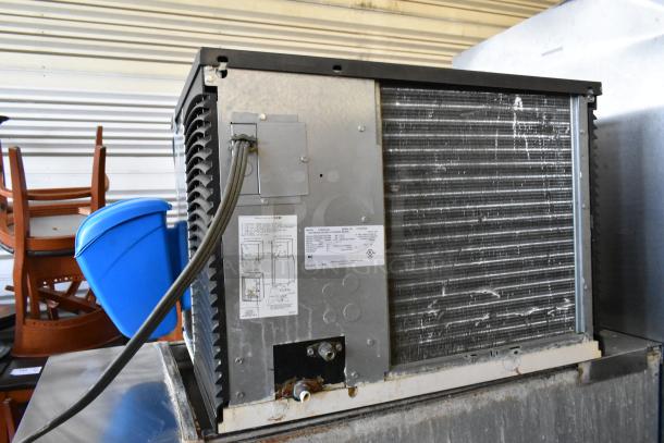 Manitowoc IY0606A-261 stainless steel commercial ice head on bin, showing back side and labels. 208-230V, 1 Phase.