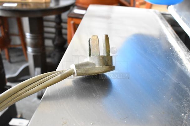 Manitowoc IY0606A-261 ice head plug on stainless steel commercial bin, 208-230V, 1 phase.