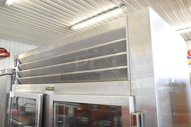 Traulsen RDH232WUT-HHG stainless steel commercial heated holding cabinet and cooler, 4 half doors, on casters, locked.