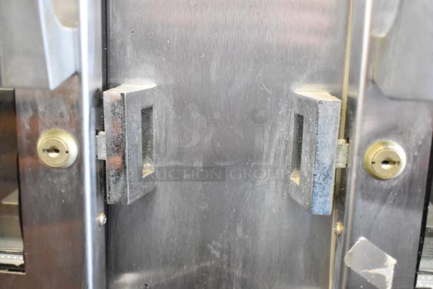 Traulsen stainless steel heated holding cabinet, model RDH232WUT-HHG, with locked doors and commercial casters, 115/208V.