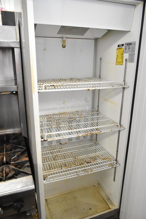 Berg BVER23 metal commercial single door reach-in cooler, on casters, 115 volts, 1 phase, shelving shows wear.