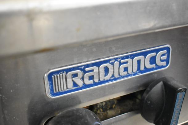 Radiance stainless steel commercial 6-burner gas range with backsplash, shelves, and casters, logo detail shown.
