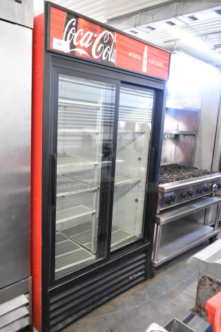True GDM-37-LD commercial cooler, 2 glass doors, poly-coated racks, Coke branding, 115V, 1 Phase, used condition.