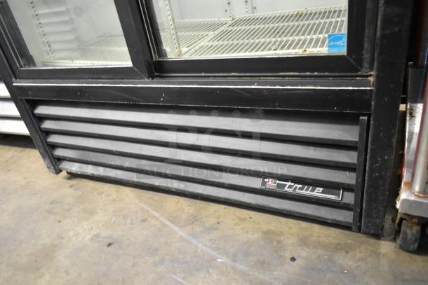 True GDM-37-LD metal commercial cooler with 2 glass doors, poly coated racks, model label visible.