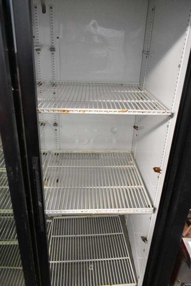 True GDM-37-LD 2 Door Commercial Cooler with poly coated racks, shows signs of wear, 115 Volts, 1 Phase.
