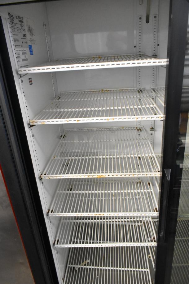 True GDM-37-LD 2 Door Reach-In Cooler, metal with poly-coated racks, 115V, 1 phase. Visible wear on shelves.