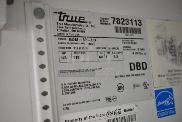 Label for True GDM-37-LD cooler; specs include 115V, 1-phase, 1/3 HP, Energy Star rated, suitable for outdoor use.