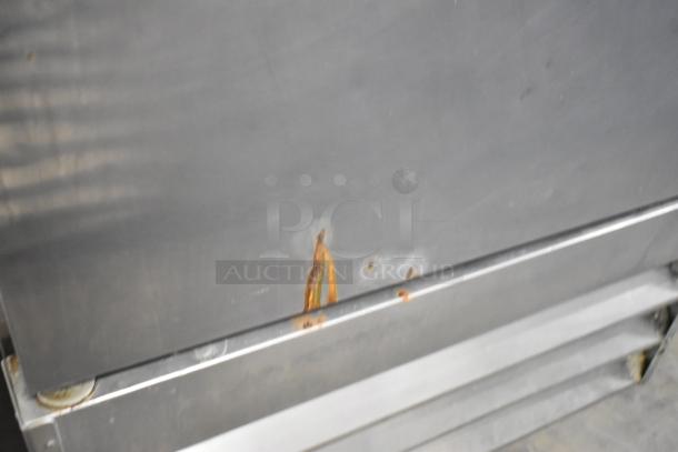 Avantco 178A19RHC commercial cooler with rust on steel surface, poly-coated racks, on casters, 115V, 1 phase.
