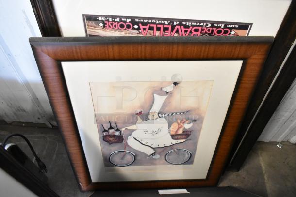 Framed picture of a chef on a bike with food items, in good condition. Includes vibrant colors and a detailed wooden frame.
