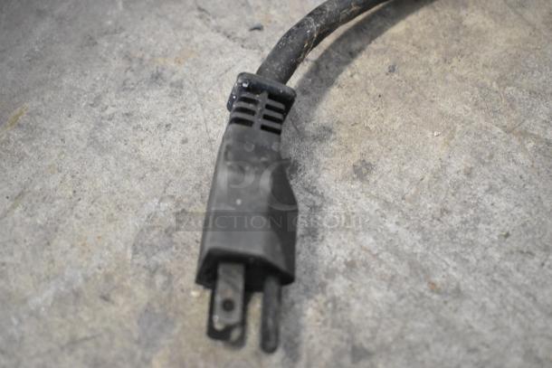 La Cimbali M21 Junior NF espresso machine power plug, showing the condition of the cable.