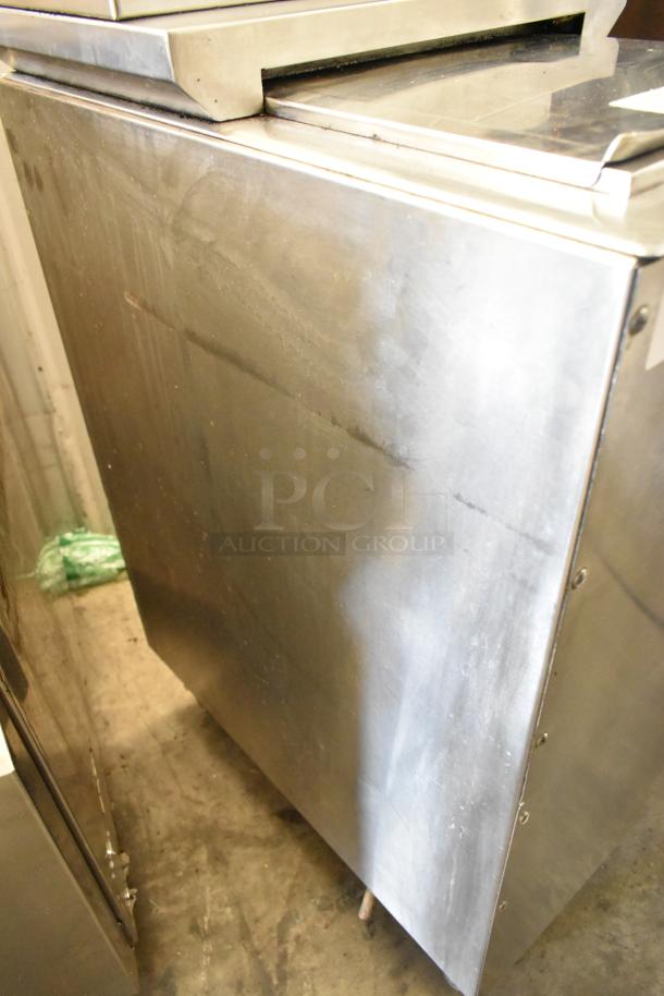 Stainless steel commercial beverage machine with six flavor options on ice bin. Uses 115 volts, 1 phase. Good condition.
