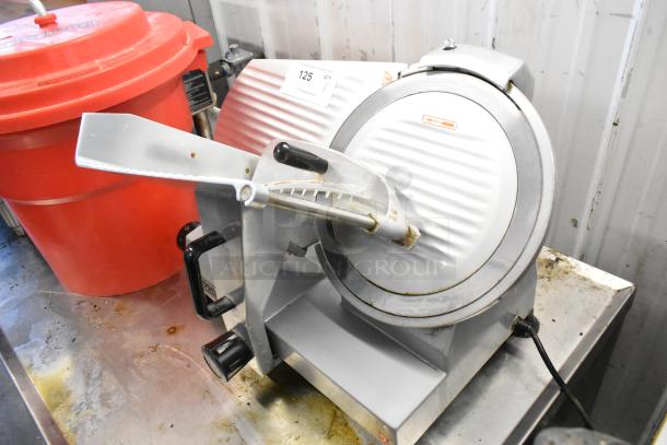 Backyard Pro 554SL112E metal commercial meat slicer with blade sharpener, 115 volts, 1 phase, visible wear.