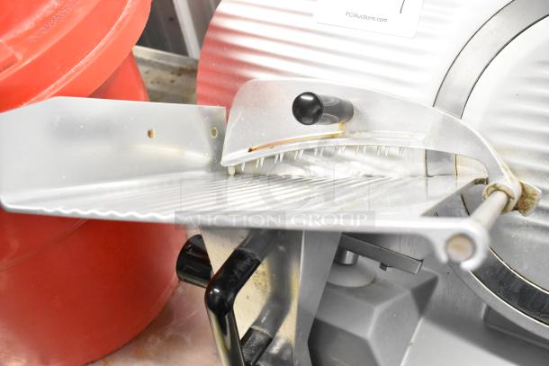 Backyard Pro 554SL112E commercial meat slicer with blade sharpener, metal construction, slight signs of use, 115V, 1 phase.