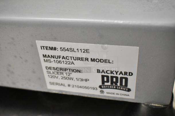 Backyard Pro 554SL112E meat slicer, model MS-106122A, with blade sharpener. Features a clear label displaying specs.