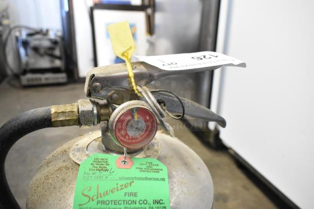 Amerex wet chemical fire extinguisher, metal valve, green label from Schweizer Fire Protection; pickup only.