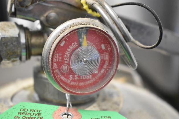 Amerex Wet Chemical Fire Extinguisher, recharge gauge showing, indicative labels and tags visible, pick-up only.