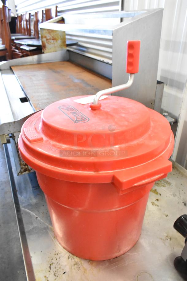 Chef Master red poly lettuce spinner with hand crank, used condition, durable plastic, visible brand logo on lid.