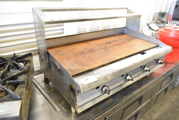 Stainless steel Cooking Performance Group 351GTCPG48NL commercial griddle with thermostatic controls and overshelf. Used condition.