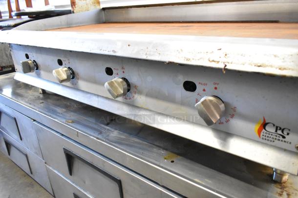 Stainless steel CPG 351GTCPG48NL commercial griddle with thermostatic controls and over shelf. Slight wear visible.
