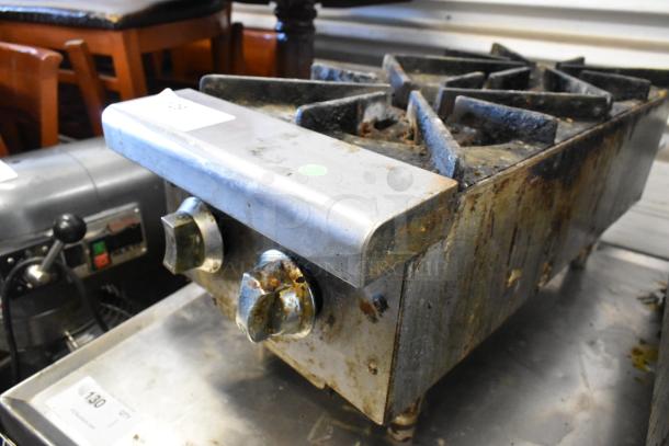 Stainless steel commercial countertop gas-powered 2 burner range, used condition, visible wear and rust.