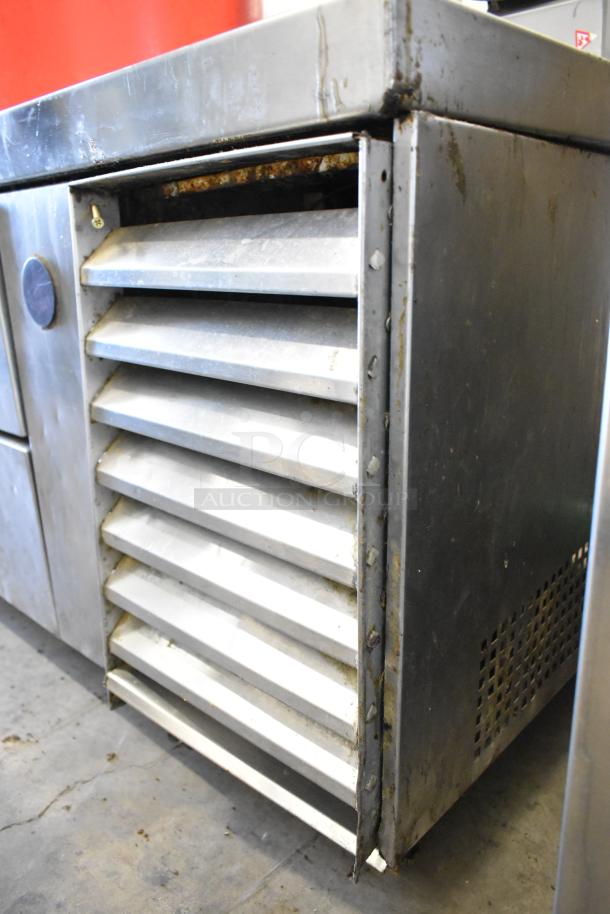 True TRCB-110 stainless steel chef base, 6 drawers, on commercial casters, 115 volts, 1 phase, used condition.
