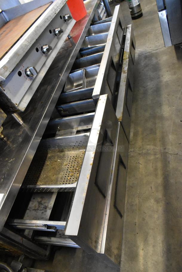 True TRCB-110 stainless steel chef base with 6 drawers on casters, 115V, 1 Phase, commercial use, visible wear.