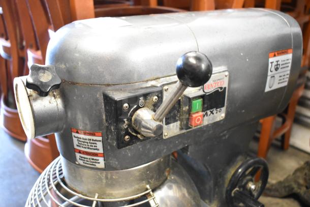 Avantco MX20 commercial mixer, metal finish, with control panel and safety warnings. Model MX20. Condition shows wear.