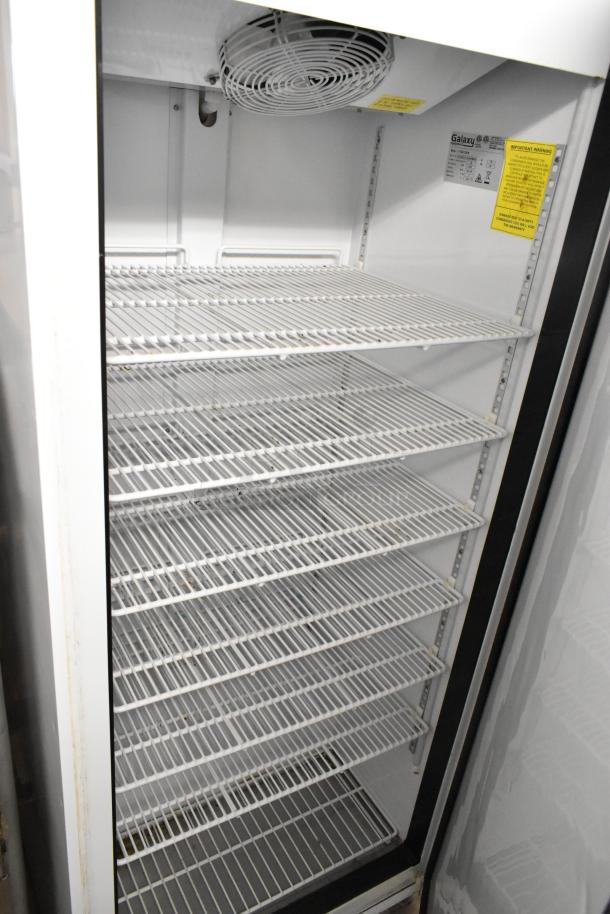 Galaxy 177GRI20FW Metal Single Door Reach In Freezer. Features wire shelving, 115 volts, 1 phase, model labels visible.
