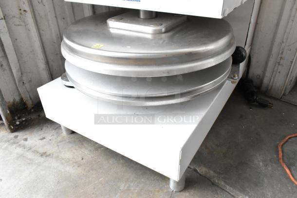 Dough Xpress DXE-W metal commercial countertop dough press. Features stainless steel plates. 120 volts, 1 phase.