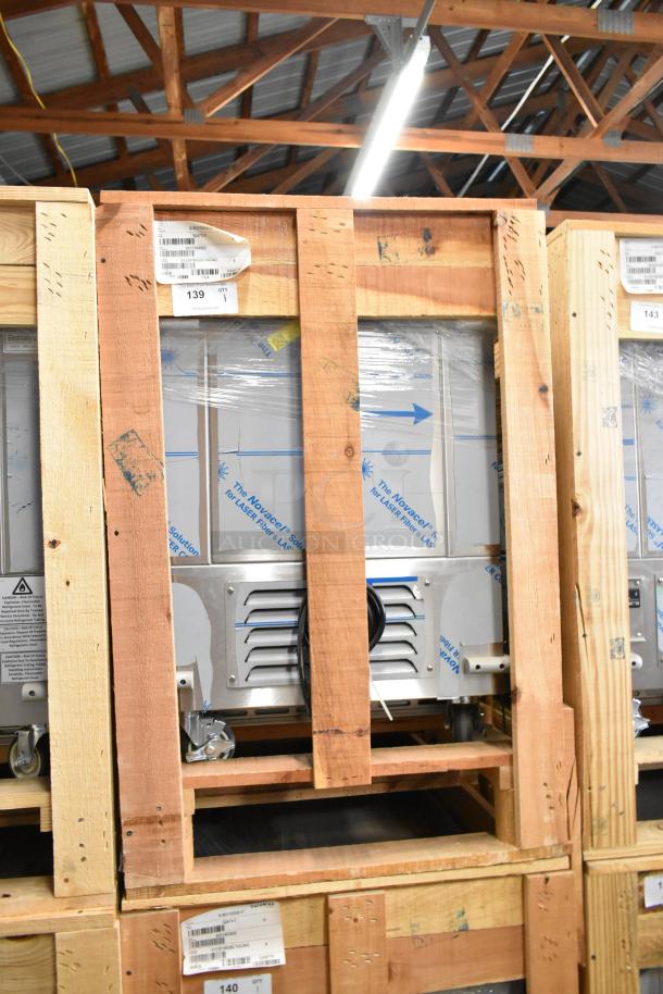 Brand new BKI 52473-1 stainless steel commercial meat freezer, crated, on commercial casters, 115V, 1 phase.