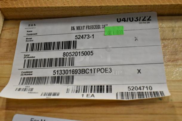Label on a wooden crate for a BKI 52473-1 stainless steel commercial meat freezer. Includes model and serial numbers.