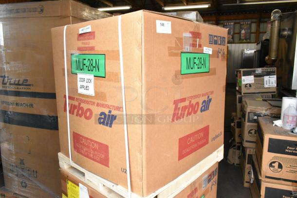 Brand new Turbo Air MUF-28-N stainless steel commercial freezer in box, 115 volts, labeled "Door Lock Applied."