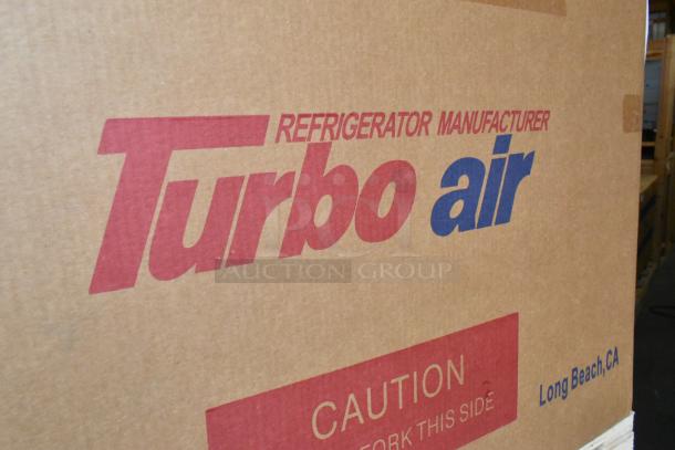 Brand new Turbo Air MUF-28-N stainless steel undercounter freezer in box, 115V, 1 phase, with caution label.