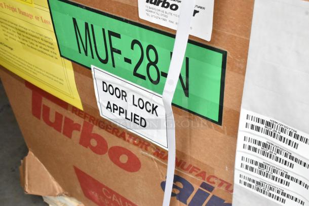 Brand new Turbo Air MUF-28-N undercounter freezer, in box, labels indicate 115V, 1 phase, door lock applied.