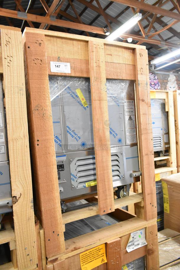 Brand new BKI 52473-1 stainless steel commercial meat freezer in crate, on casters, 115V, 1 phase. Model label visible.