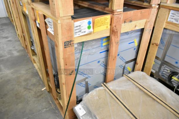BRAND NEW 2022 BKI 52473-1 stainless steel commercial meat freezer, crated, on casters, 115V, 1 Phase. Tags visible.