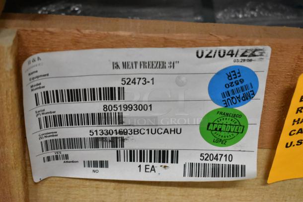 BRAND NEW 2022 BKI 52473-1 Stainless Steel Commercial Meat Freezer, 115 Volts, 1 Phase, on casters, in crate with barcode label.