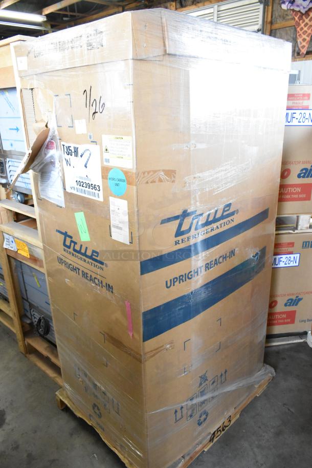 2021 True T-35-HC Commercial 2 Door Cooler, new in box, 115 volts. Box marked with model and handling labels.