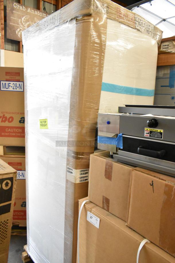 Brand new Turbo Air ER24-1-N6-V stainless steel commercial cooler in box. Single door, 115V, 1 phase, with packaging labels.