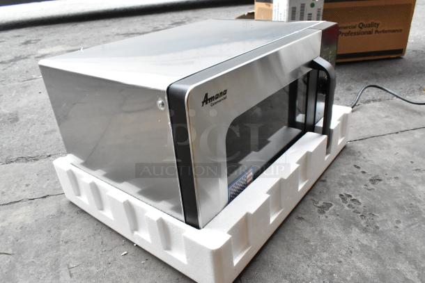 New Amana RMS10DSA stainless steel commercial microwave in crate, 2021 model, dial controls, pristine condition.